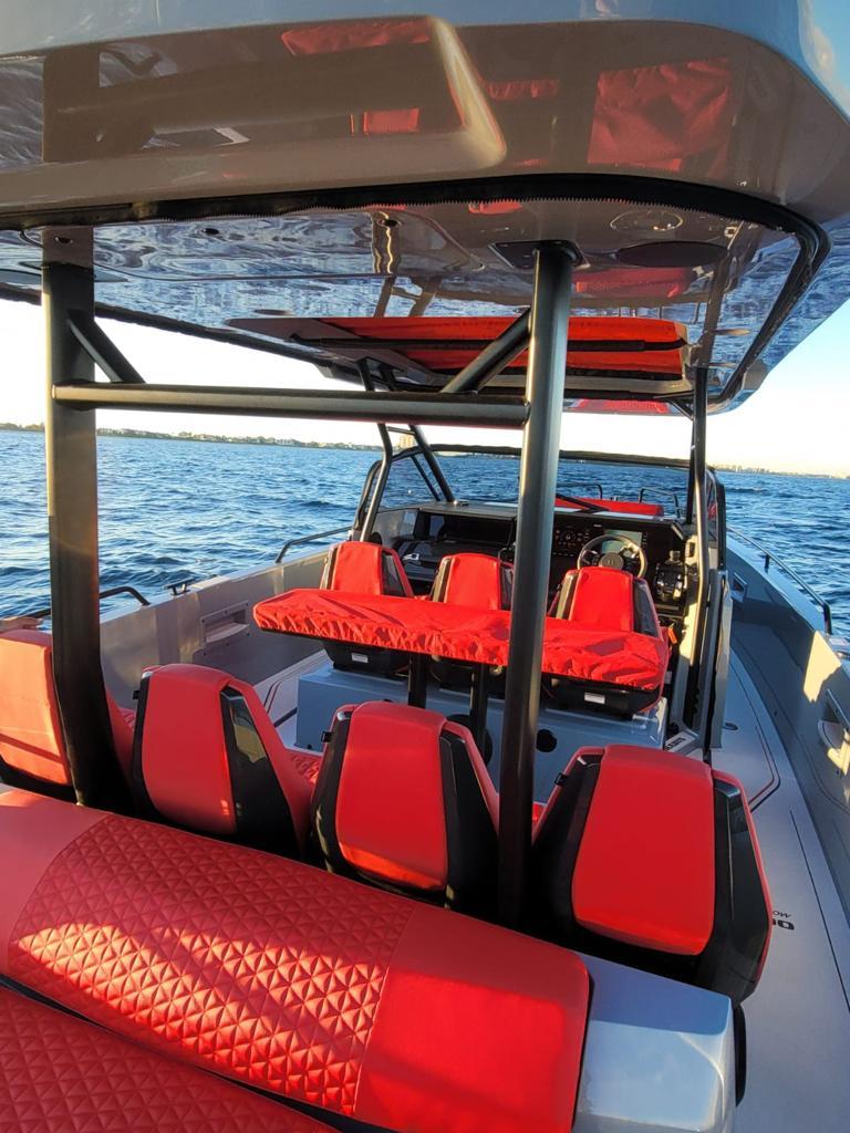2022 BRABUS Shadow 900 ST boat with red seating on the water.