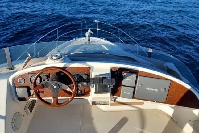  Yacht Photos Pics 2005 Jeanneau PRESTIGE 32 FLY yacht helm with ocean view.