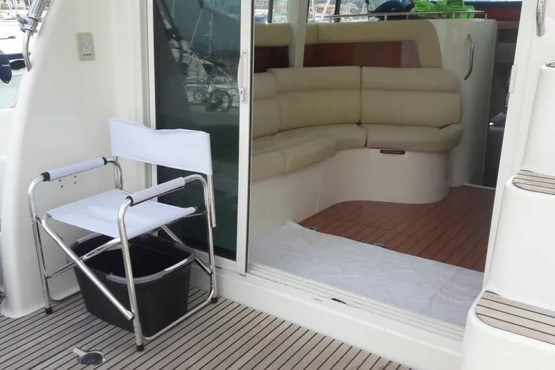  Yacht Photos Pics Interior view of 2005 Jeanneau PRESTIGE 32 FLY yacht with seating and deck chair.