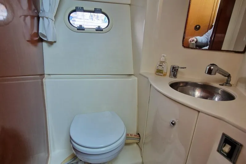  Yacht Photos Pics Bathroom interior of 2005 Jeanneau PRESTIGE 32 FLY yacht with sink and toilet.