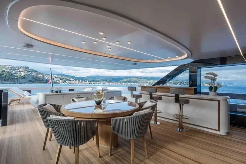 L.a.u.l. Yacht Photos Pics Luxurious yacht deck with modern seating, bar, and scenic ocean view, ISA Extra 130 Alloy 2019.