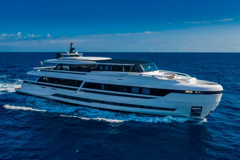 L.a.u.l. Yacht Photos Pics Luxury yacht ISA Extra 130 Alloy 2019 cruising on open sea under clear blue sky.