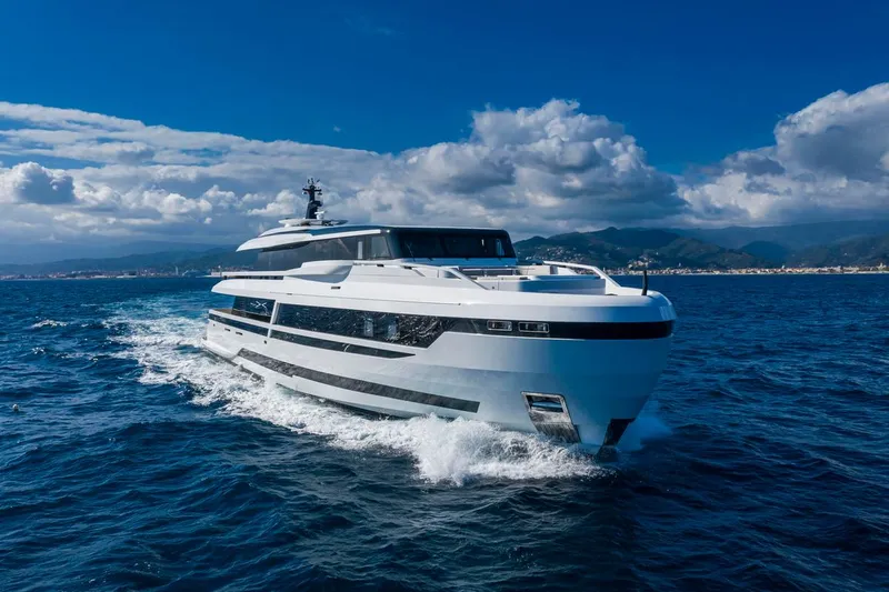 L.a.u.l. Yacht Photos Pics Luxurious 2019 ISA Extra 130 Alloy yacht cruising on open sea under blue sky.
