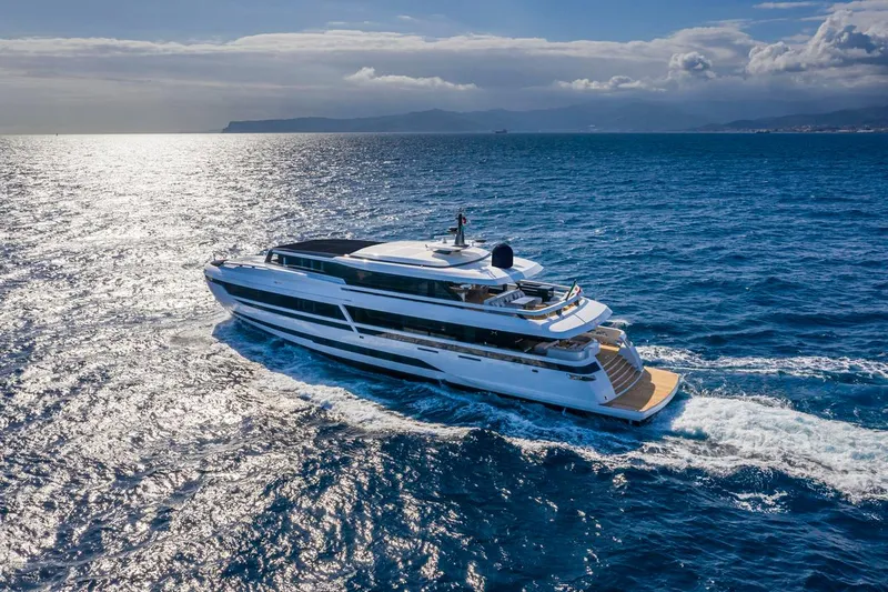 L.a.u.l. Yacht Photos Pics Luxurious 2019 ISA Extra 130 Alloy yacht cruising on open sea under clear skies.