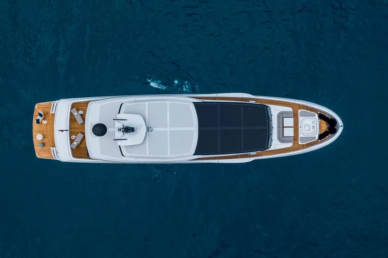 L.a.u.l. Yacht Photos Pics Top view of 2019 ISA Extra 130 Alloy yacht on blue ocean water.
