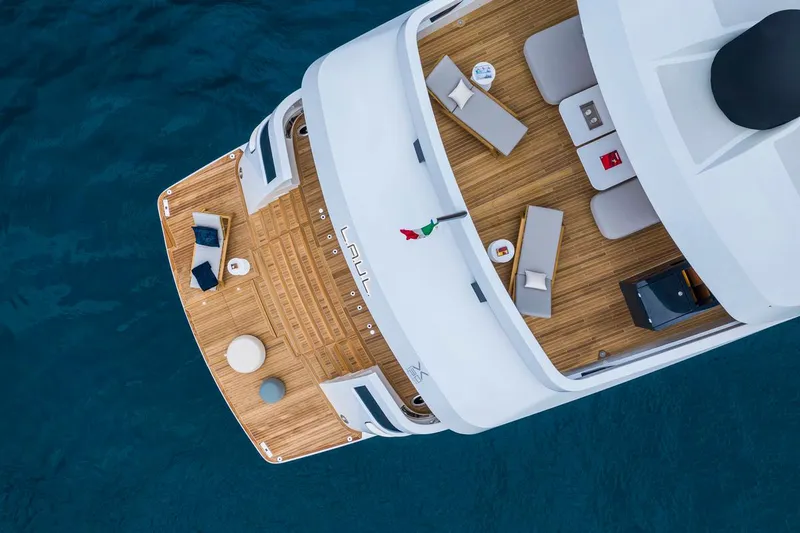 L.a.u.l. Yacht Photos Pics Aerial view of 2019 ISA Extra 130 Alloy yacht deck with seating and tables.