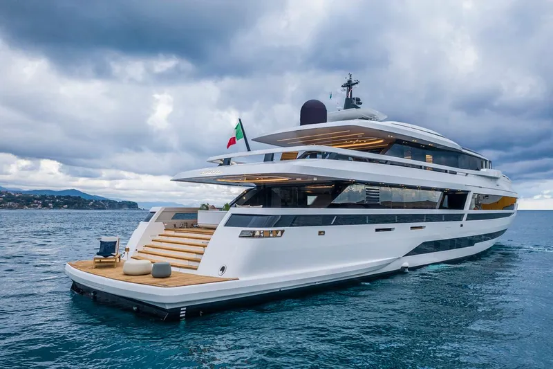 L.a.u.l. Yacht Photos Pics Luxurious 2019 ISA Extra 130 Alloy yacht cruising on a serene ocean under cloudy skies.