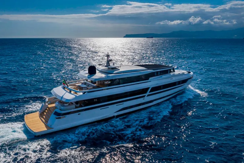 L.a.u.l. Yacht Photos Pics Luxurious 2019 ISA Extra 130 Alloy yacht cruising on open sea under clear skies.
