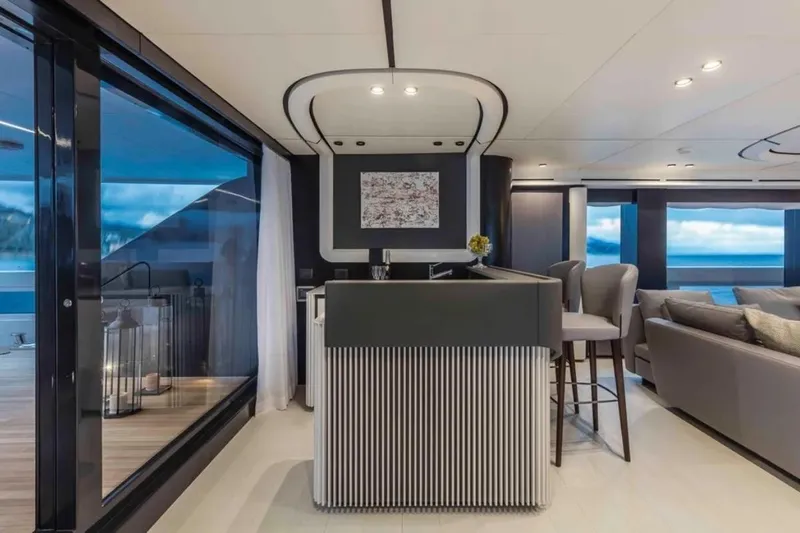 L.a.u.l. Yacht Photos Pics Luxurious interior of 2019 ISA Extra 130 Alloy yacht with modern bar and seating area.