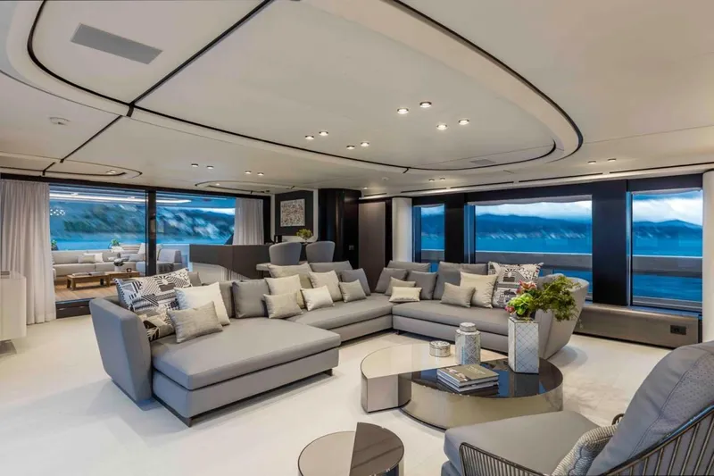 L.a.u.l. Yacht Photos Pics Luxurious yacht interior with modern gray sofas, panoramic windows, and elegant decor. ISA Extra 130 Alloy, 2019.