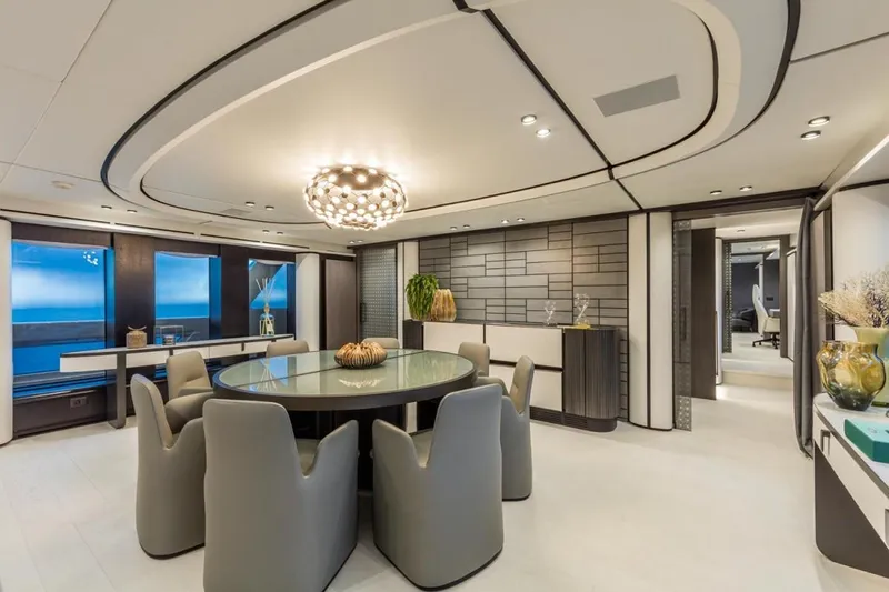 L.a.u.l. Yacht Photos Pics Luxurious dining area on 2019 ISA Extra 130 Alloy yacht with modern decor and ocean view.