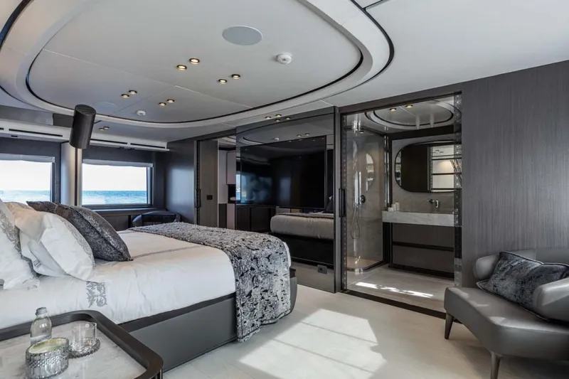 L.a.u.l. Yacht Photos Pics Luxurious bedroom interior on 2019 ISA Extra 130 Alloy yacht, featuring modern design and ocean view.