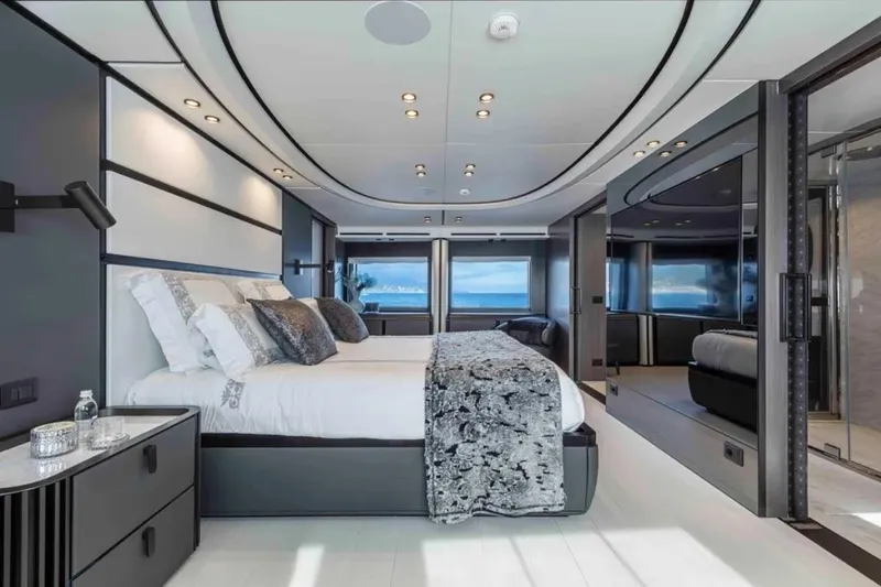 L.a.u.l. Yacht Photos Pics Luxurious bedroom interior on 2019 ISA Extra 130 Alloy yacht, featuring modern design and ocean views.
