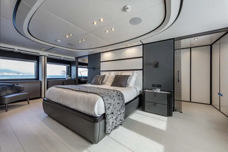 L.a.u.l. Yacht Photos Pics Luxurious bedroom interior on ISA Extra 130 Alloy yacht, 2019 model, featuring modern design and ocean views.