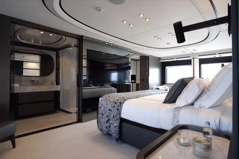 L.a.u.l. Yacht Photos Pics Luxurious bedroom interior on 2019 ISA Extra 130 Alloy yacht, featuring modern design and elegant decor.