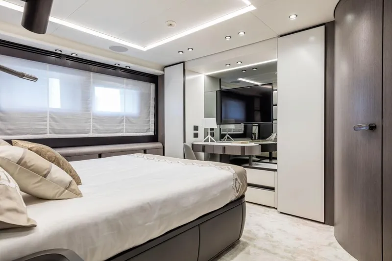 L.a.u.l. Yacht Photos Pics Luxurious bedroom interior on 2019 ISA Extra 130 Alloy yacht, featuring modern design and elegant furnishings.