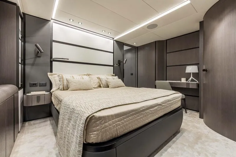 L.a.u.l. Yacht Photos Pics Luxurious bedroom interior on 2019 ISA Extra 130 Alloy yacht, featuring modern design and elegant furnishings.