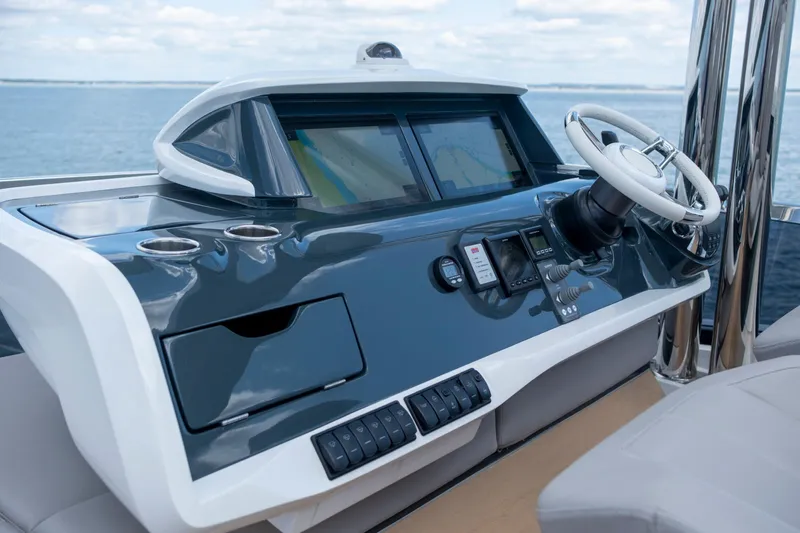 Madness V Yacht Photos Pics Helm of 2022 Pearl 62 yacht with modern controls and steering wheel.