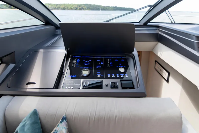 Madness V Yacht Photos Pics Control panel of a 2022 Pearl 62 yacht, featuring modern navigation instruments.