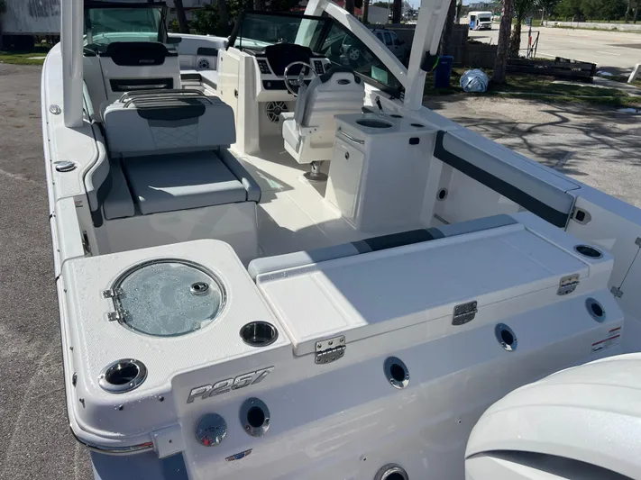 Yacht Photos Pics 2025 Robalo R257 Dual Console boat interior with seating and helm.