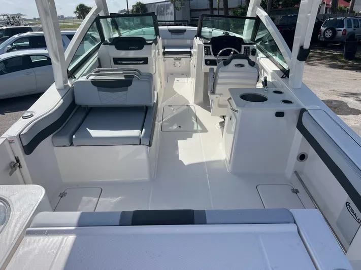  Yacht Photos Pics 2025 Robalo R257 Dual Console boat interior with seating and helm station.