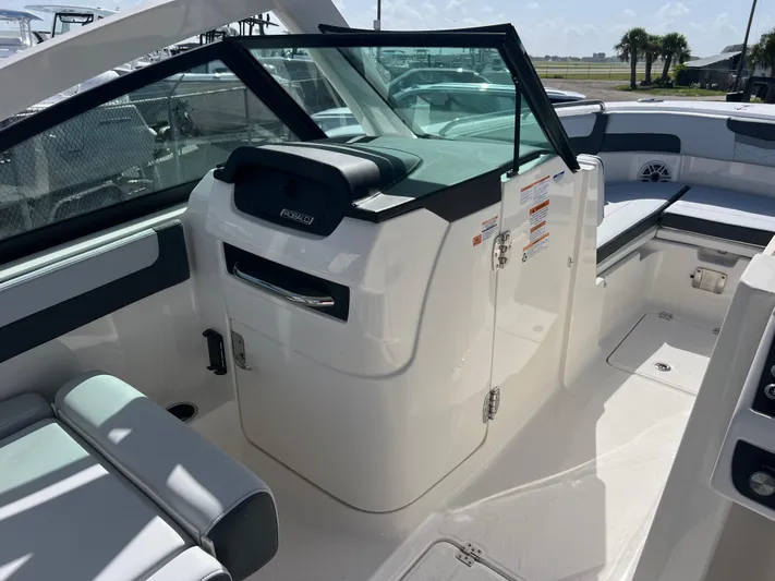  Yacht Photos Pics 2025 Robalo R257 Dual Console boat interior with seating and storage compartments.