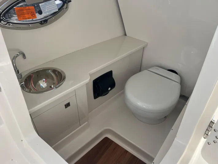  Yacht Photos Pics 2025 Robalo R257 Dual Console boat interior with sink and toilet.