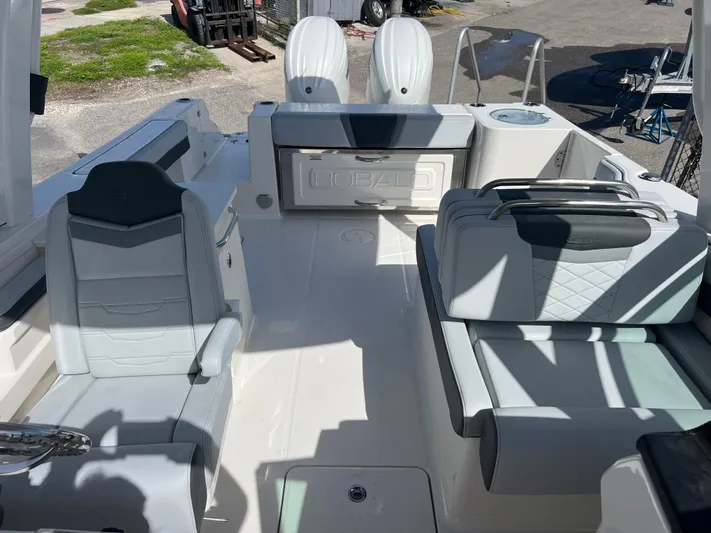  Yacht Photos Pics 2025 Robalo R257 Dual Console boat interior with seating and storage compartments.