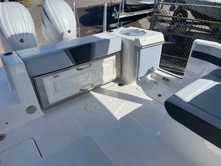  Yacht Photos Pics 2025 Robalo R257 Dual Console boat interior with seating and storage compartments.