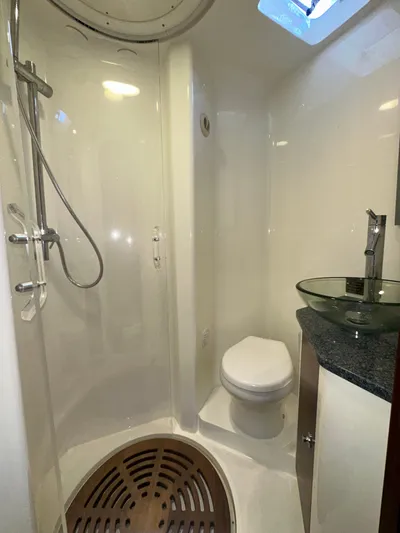Wooocrew Yacht Photos Pics 2015 SeaVee 43 Fish-Around bathroom with shower, toilet, and glass sink.