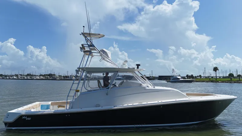 Wooocrew Yacht Photos Pics 2015 SeaVee 43 Fish-Around boat on calm water under a blue sky.