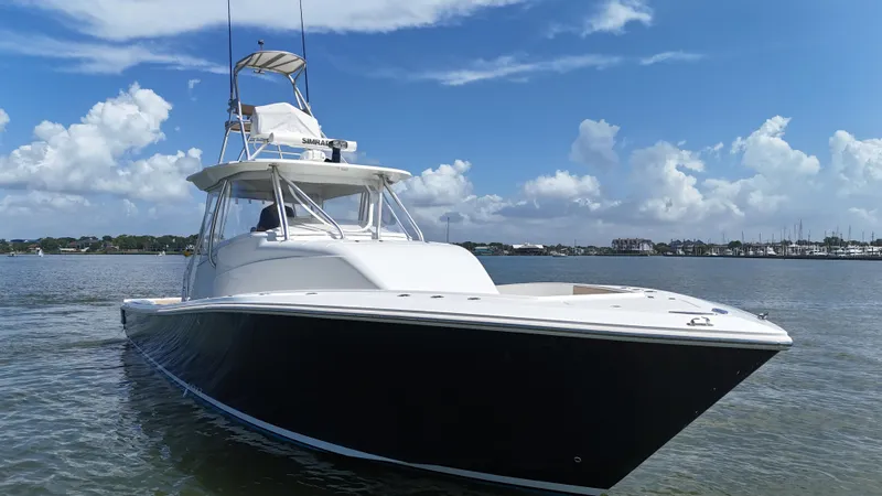 Wooocrew Yacht Photos Pics 2015 SeaVee 43 Fish-Around boat on calm water under a blue sky.