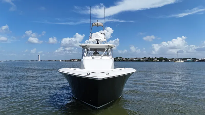 Wooocrew Yacht Photos Pics 2015 SeaVee 43 Fish-Around boat on calm water under blue sky.