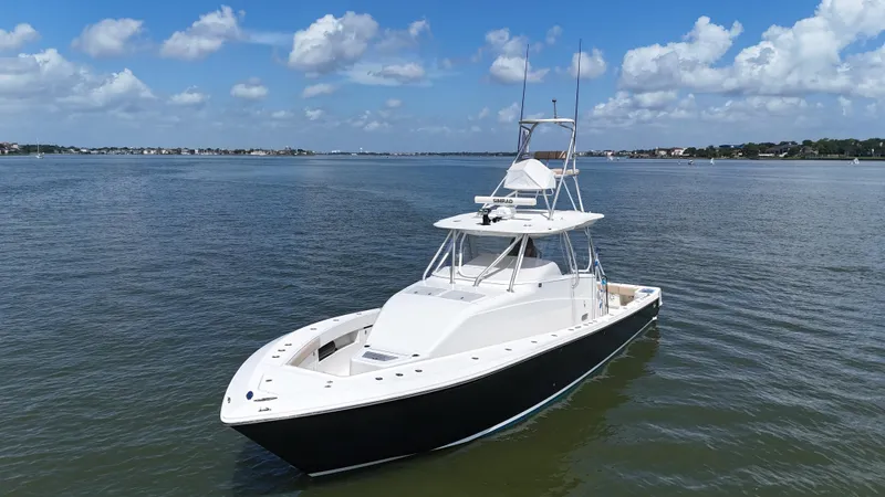 Wooocrew Yacht Photos Pics 2015 SeaVee 43 Fish-Around boat on calm water under blue sky.
