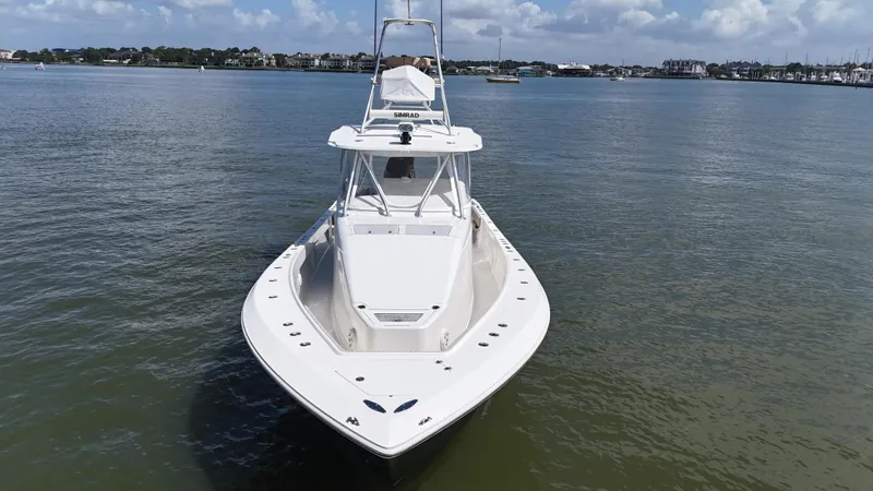 Wooocrew Yacht Photos Pics 2015 SeaVee 43 Fish-Around boat on calm water, clear sky background.