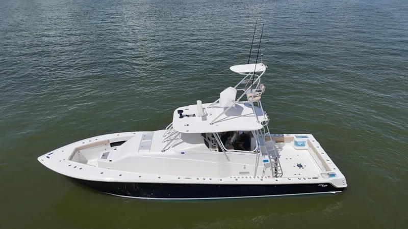 Wooocrew Yacht Photos Pics 2015 SeaVee 43 Fish-Around boat on calm water, side view.