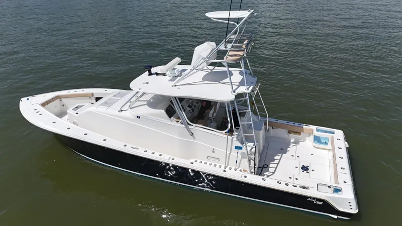 Wooocrew Yacht Photos Pics 2015 SeaVee 43 Fish-Around boat on calm water, featuring a sleek design and spacious deck.