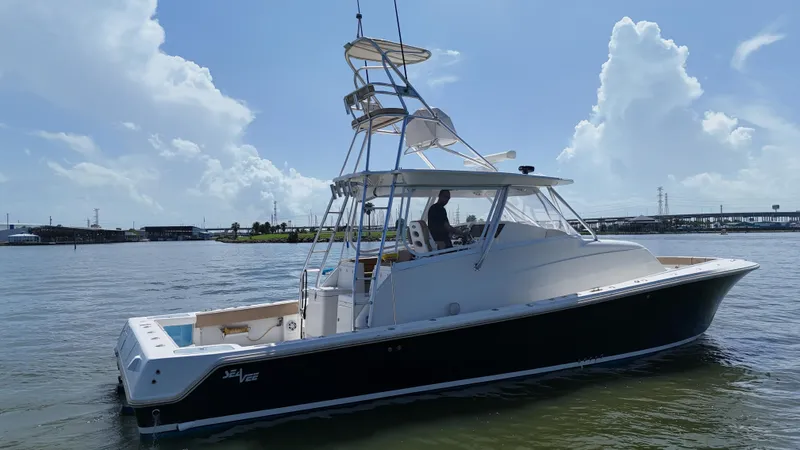 Wooocrew Yacht Photos Pics 2015 SeaVee 43 Fish-Around boat on calm water under a clear sky.
