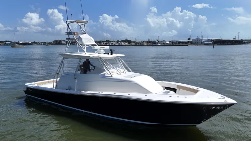 Wooocrew Yacht Photos Pics 2015 SeaVee 43 Fish-Around boat on calm water, clear sky background.
