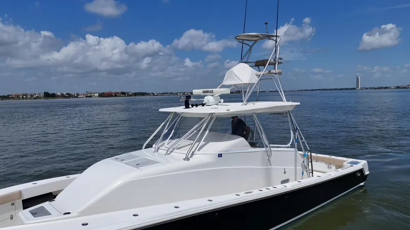Wooocrew Yacht Photos Pics 2015 SeaVee 43 Fish-Around boat on calm water under blue sky.