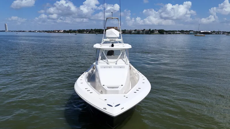 Wooocrew Yacht Photos Pics 2015 SeaVee 43 Fish-Around boat on calm water under a partly cloudy sky.