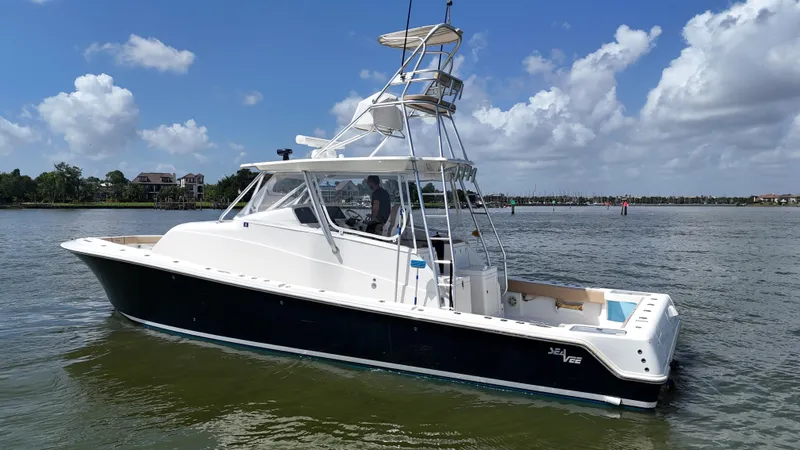 Wooocrew Yacht Photos Pics 2015 SeaVee 43 Fish-Around boat on calm water under a blue sky.