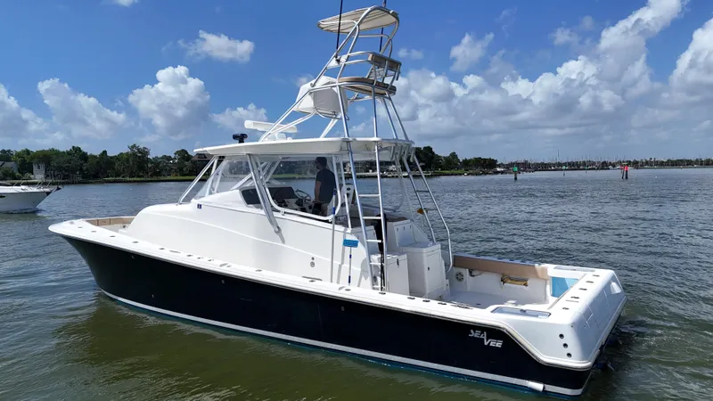 Wooocrew Yacht Photos Pics 2015 SeaVee 43 Fish-Around boat on calm water under a blue sky.
