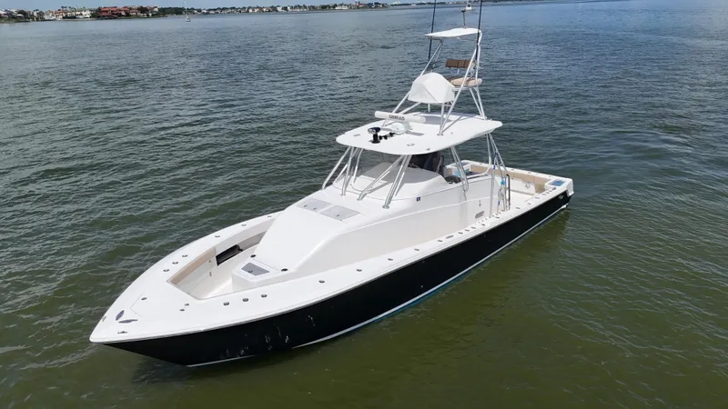Wooocrew Yacht Photos Pics 2015 SeaVee 43 Fish-Around boat on calm water, showcasing sleek design and spacious deck.