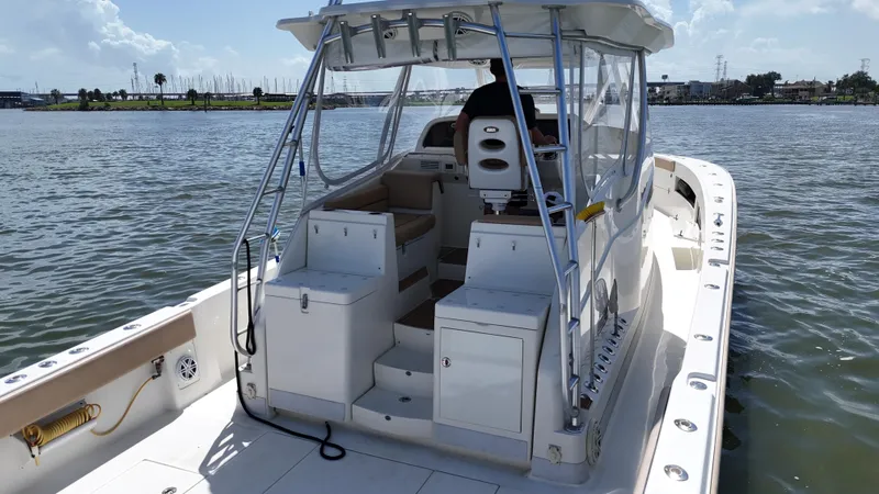 Wooocrew Yacht Photos Pics 2015 SeaVee 43 Fish-Around boat on water, featuring spacious deck and helm.