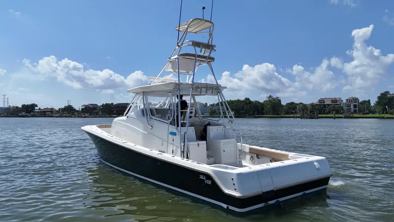 Wooocrew Yacht Photos Pics 2015 SeaVee 43 Fish-Around boat on calm water under a clear blue sky.
