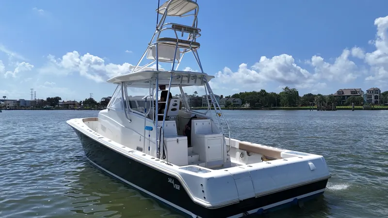 Wooocrew Yacht Photos Pics 2015 SeaVee 43 Fish-Around boat on calm water, clear sky background.