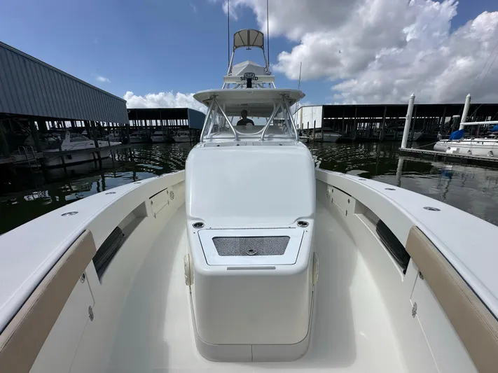 Wooocrew Yacht Photos Pics 2015 SeaVee 43 Fish-Around boat docked, showcasing spacious deck and sleek design.