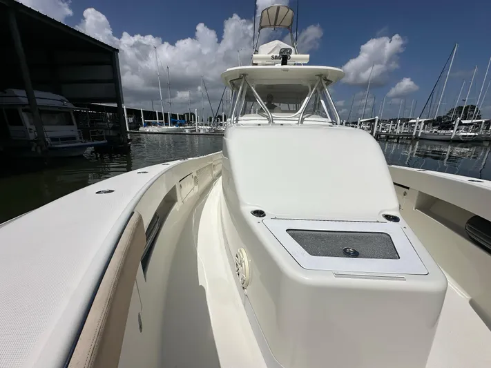 Wooocrew Yacht Photos Pics 2015 SeaVee 43 Fish-Around boat docked at marina under blue sky.