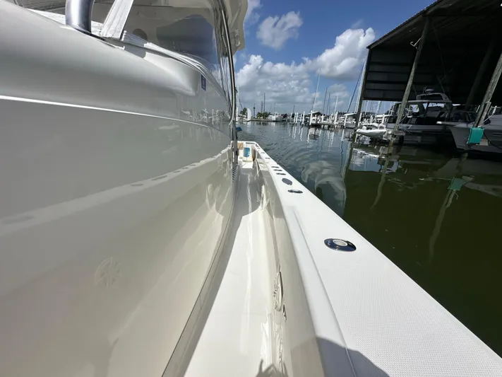 Wooocrew Yacht Photos Pics 2015 SeaVee 43 Fish-Around boat docked at marina under clear blue sky.